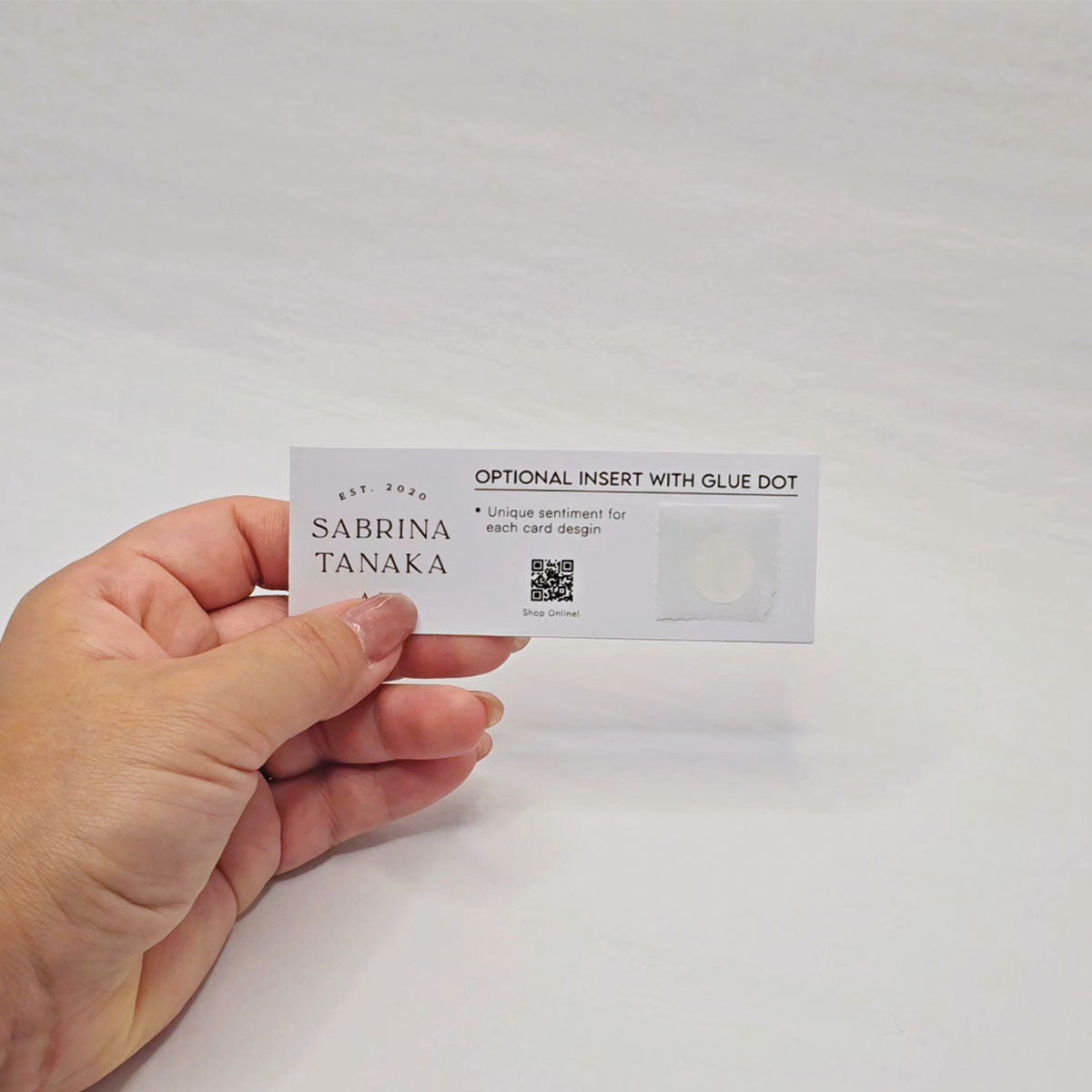 Instruction slip with glue dot attached to it.