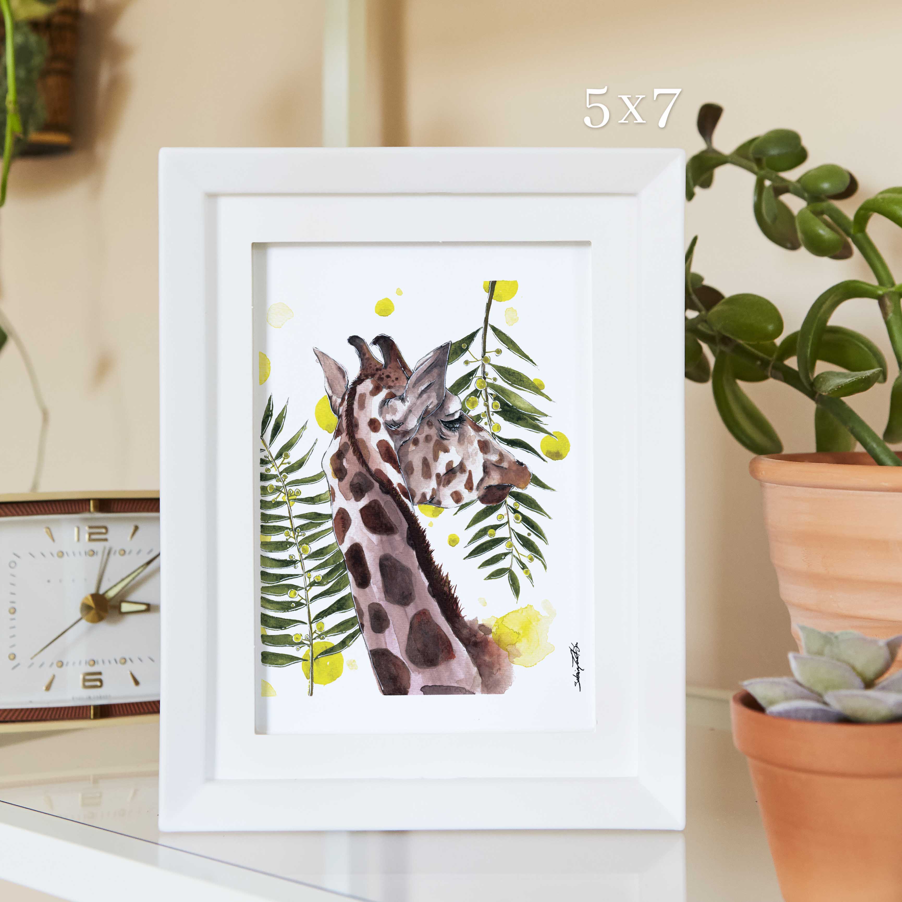 Giraffe with leaves