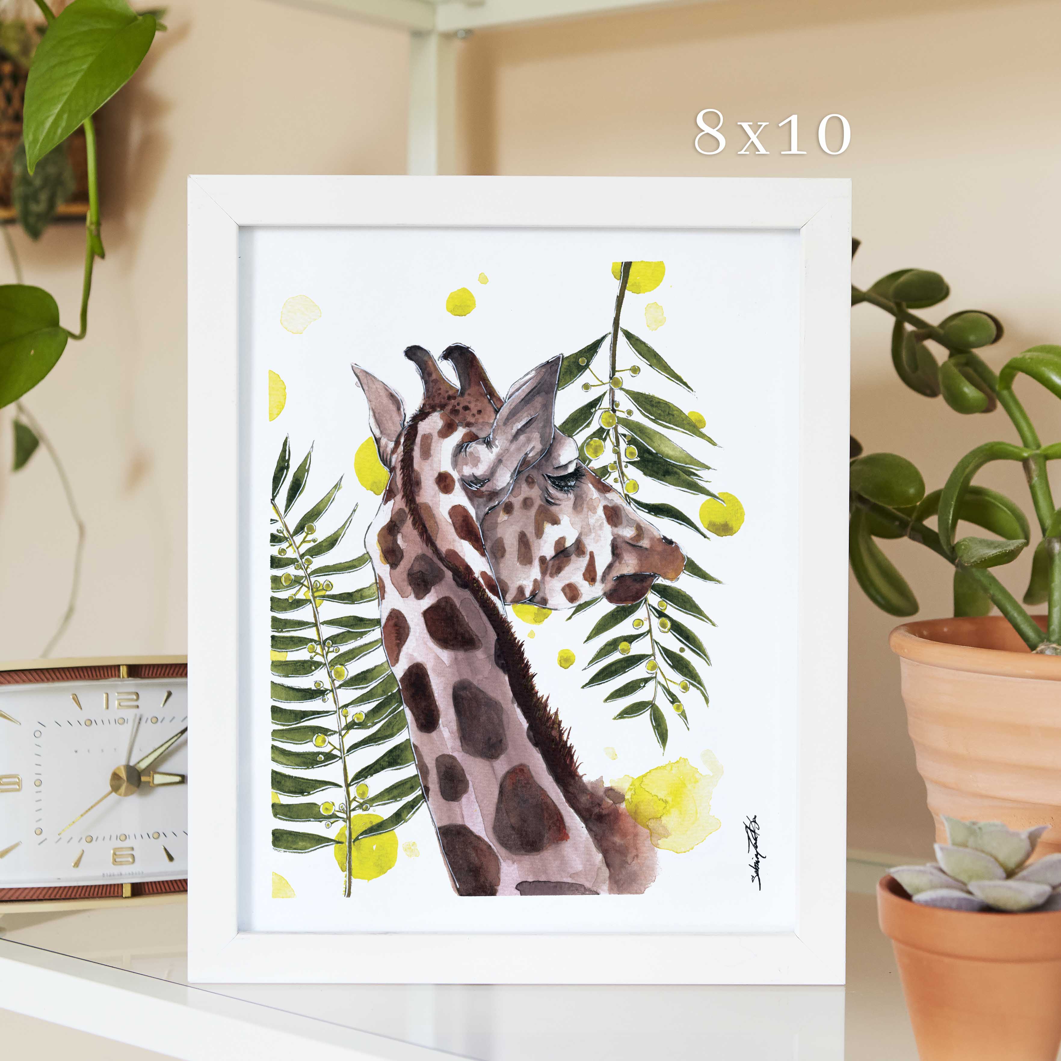 Giraffe with leaves